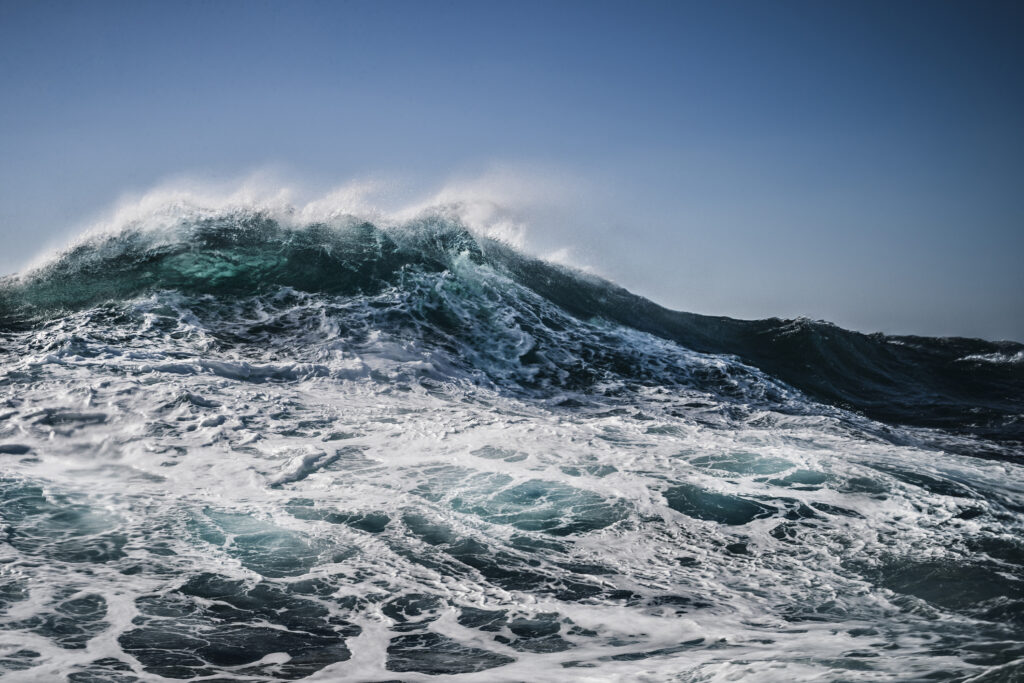 waves crashing on open ocean